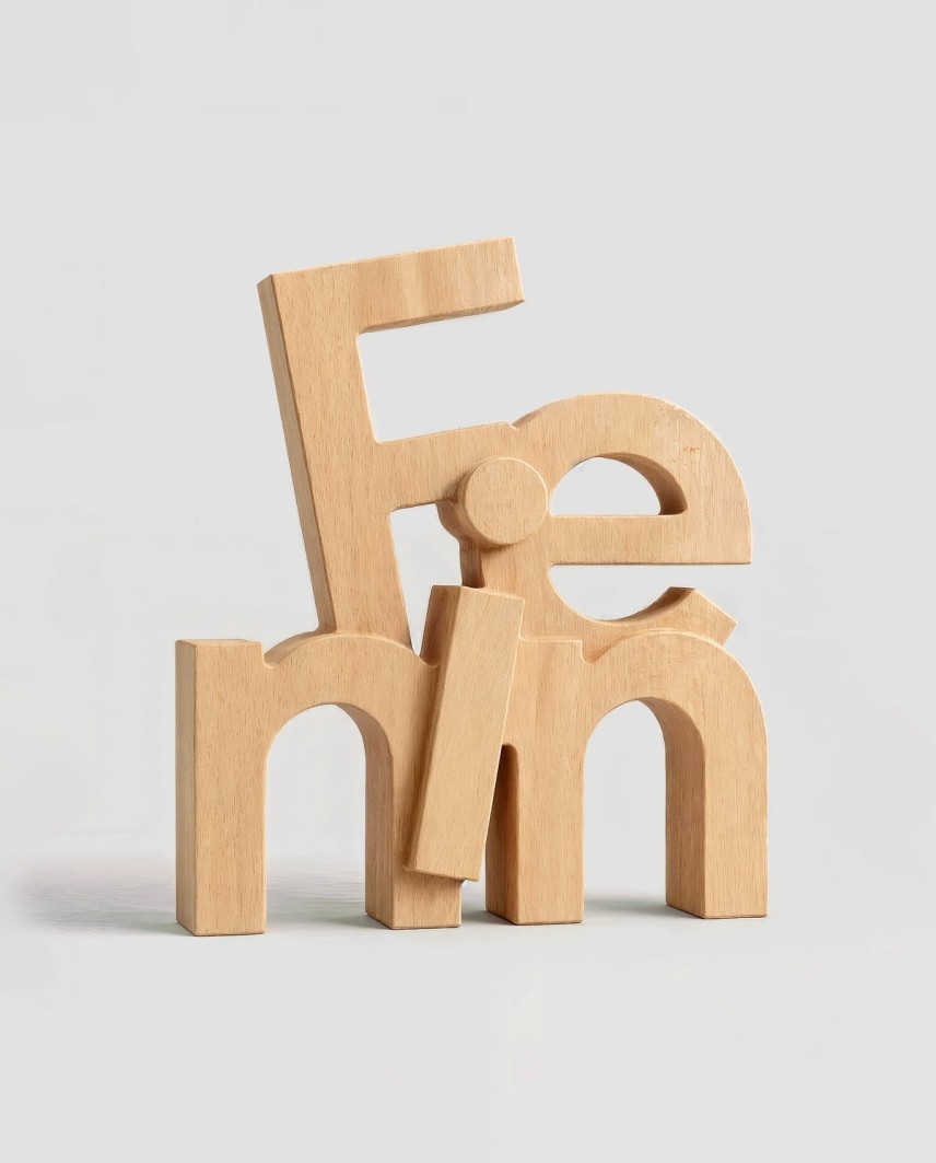 Fenin Award 2026 in FSC beech wood with three-dimensional typography, designed and manufactured using CNC milling
