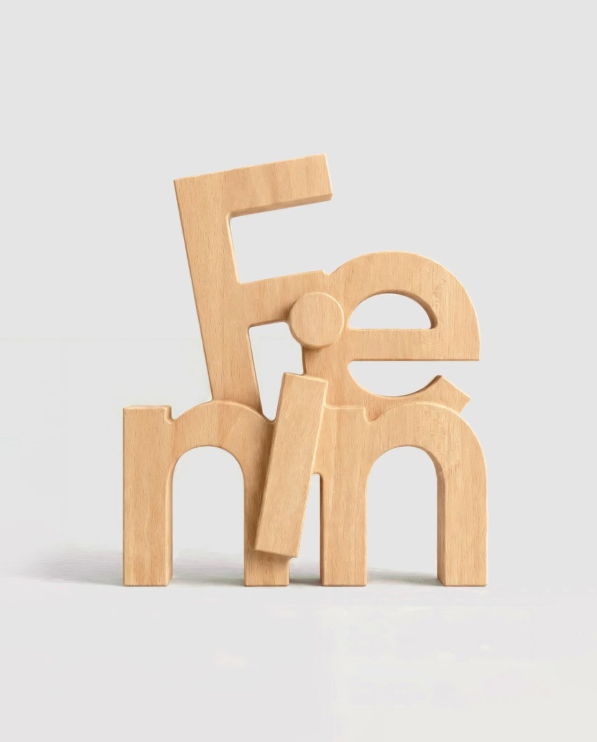 Fenin Award 2026 in FSC beech wood with three-dimensional typography, designed and manufactured using CNC milling
