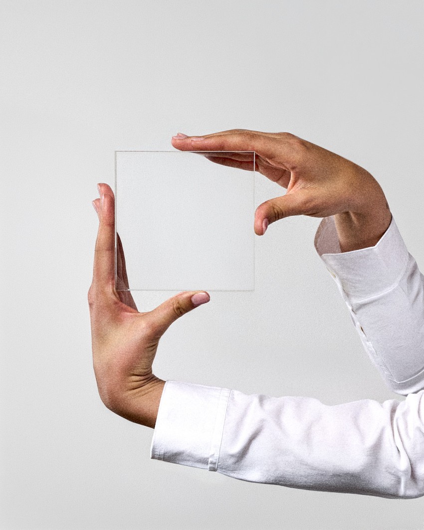 Acrylic award plaque in VITRA MINI format, ready to personalize, held by a model